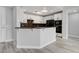 Modern kitchen featuring granite counters, a breakfast bar, and stainless steel appliances at 27 E Agate Ave # 505, Las Vegas, NV 89123