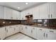 Stylish kitchen with granite countertops, modern appliances, and ample storage at 27 E Agate Ave # 505, Las Vegas, NV 89123