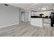 Open concept kitchen with white cabinets and modern appliances at 27 E Agate Ave # 505, Las Vegas, NV 89123
