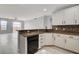 Open kitchen with granite countertops, breakfast bar, and stainless steel dishwasher at 27 E Agate Ave # 505, Las Vegas, NV 89123