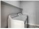 Laundry room featuring full size washer and dryer with overhead shelf at 27 E Agate Ave # 505, Las Vegas, NV 89123
