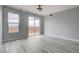 Spacious living room with sliding glass doors to a balcony and sleek hardwood floors at 27 E Agate Ave # 505, Las Vegas, NV 89123