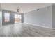 Bright living room with grey walls, white trim and balcony access at 27 E Agate Ave # 505, Las Vegas, NV 89123