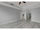This main bedroom features hardwood floors and neutral wall paint with an ensuite bathroom at 27 E Agate Ave # 505, Las Vegas, NV 89123