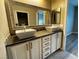 Bathroom featuring double sinks and a large mirror, providing ample space and style at 2704 Willow Wren Dr, North Las Vegas, NV 89084