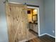 Bathroom view through the sliding barn door at 2704 Willow Wren Dr, North Las Vegas, NV 89084