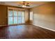Bedroom featuring wide sliding doors and new floors at 2704 Willow Wren Dr, North Las Vegas, NV 89084