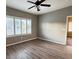 Bedroom with hardwood floors, ceiling fan and windows at 2704 Willow Wren Dr, North Las Vegas, NV 89084