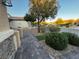 Inviting front walkway leading to a charming home with desert landscaping at 2704 Willow Wren Dr, North Las Vegas, NV 89084
