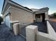 Inviting front entrance with tiled pathway and stucco pillars at 2704 Willow Wren Dr, North Las Vegas, NV 89084