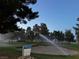 Scenic view of the well-maintained golf course with lush greenery and a sand trap being watered at 2704 Willow Wren Dr, North Las Vegas, NV 89084