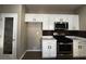 Modern kitchen design featuring stainless steel appliances and white cabinets at 2704 Willow Wren Dr, North Las Vegas, NV 89084