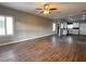 Spacious living room with hardwood floors and ceiling fan at 2704 Willow Wren Dr, North Las Vegas, NV 89084