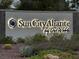 Illuminated Sun City Aliante by Del Webb community sign surrounded by lush landscaping at 2704 Willow Wren Dr, North Las Vegas, NV 89084