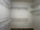Empty walk-in closet has white walls and wire shelving along the walls for ample storage at 2704 Willow Wren Dr, North Las Vegas, NV 89084