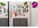 Charming bathroom with decorative accents, mirror, and stylish vanity at 2789 Trotwood Ln, Las Vegas, NV 89108