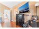 This bedroom features a wall mounted TV, wood floors, dresser, and good lighting at 2789 Trotwood Ln, Las Vegas, NV 89108