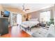 This bedroom features a ceiling fan, queen bed, a TV, and a sliding glass door at 2789 Trotwood Ln, Las Vegas, NV 89108
