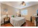 Cozy bedroom featuring a ceiling fan, wood floors, and neutral paint colors at 2789 Trotwood Ln, Las Vegas, NV 89108