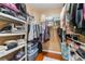 Walk-in closet with shelving and plentiful hanging space for clothes and accessories at 2789 Trotwood Ln, Las Vegas, NV 89108