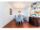 Dining room with wood floors, light fixture, and decorative wall art at 2789 Trotwood Ln, Las Vegas, NV 89108