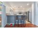 Kitchen bar area features barstool seating and lots of natural light at 2789 Trotwood Ln, Las Vegas, NV 89108