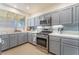 Kitchen with stainless steel appliances and a window above the sink at 2789 Trotwood Ln, Las Vegas, NV 89108
