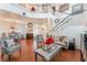 Spacious living room with stairway, fireplace, and dining area at 2789 Trotwood Ln, Las Vegas, NV 89108
