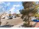 Street view featuring nearby homes, driveway parking, and greenery at 2789 Trotwood Ln, Las Vegas, NV 89108
