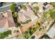 Aerial view of a charming home featuring mature trees, desert landscaping, and a covered patio in a quiet community at 3029 Brownbirds Nest Dr, Henderson, NV 89052