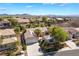 Aerial view showcasing a single-story home in a neighborhood with mountain views and desert landscaping at 3029 Brownbirds Nest Dr, Henderson, NV 89052
