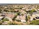 Aerial view of a home featuring mature trees, desert landscaping, and a covered patio in a well-planned community at 3029 Brownbirds Nest Dr, Henderson, NV 89052