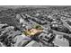 A single residence is highlighted among other homes in a residential neighborhood in this creative aerial real estate view at 3029 Brownbirds Nest Dr, Henderson, NV 89052