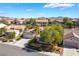 Aerial view showcasing a single-story home and surrounding neighborhood with mountain views at 3029 Brownbirds Nest Dr, Henderson, NV 89052