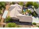 Aerial view of home featuring a private backyard with desert landscaping and a swimming pool, enclosed by a fence at 3029 Brownbirds Nest Dr, Henderson, NV 89052