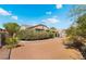 Expansive backyard featuring desert landscaping and a covered patio, perfect for outdoor entertaining at 3029 Brownbirds Nest Dr, Henderson, NV 89052