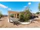 Backyard with patio cover and low-maintenance desert landscaping at 3029 Brownbirds Nest Dr, Henderson, NV 89052