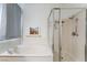 Bathroom showcasing a soaking tub and glass-enclosed shower at 3029 Brownbirds Nest Dr, Henderson, NV 89052