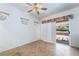 Bright bedroom with a sliding glass door to the patio and tile flooring at 3029 Brownbirds Nest Dr, Henderson, NV 89052
