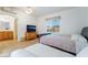 Bright bedroom with two beds, TV and attached bathroom; providing ample space for guests at 3029 Brownbirds Nest Dr, Henderson, NV 89052