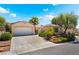 Inviting single-story home with a two-car garage and mature landscaping at 3029 Brownbirds Nest Dr, Henderson, NV 89052