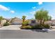 Charming single-story home featuring a two-car garage, landscaped front yard, and desert-friendly landscaping at 3029 Brownbirds Nest Dr, Henderson, NV 89052