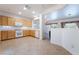 Well-lit kitchen with ample cabinet space, tile flooring, and modern white appliances at 3029 Brownbirds Nest Dr, Henderson, NV 89052