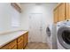 Laundry room with washer, dryer, cabinets, and countertop space at 3029 Brownbirds Nest Dr, Henderson, NV 89052