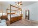 Primary bedroom with four poster bed, ceiling fan, and neutral decor at 3029 Brownbirds Nest Dr, Henderson, NV 89052