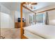 Large primary bedroom featuring a four poster bed, carpet and bay window at 3029 Brownbirds Nest Dr, Henderson, NV 89052