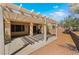 Backyard covered patio with grill and desert landscaping at 3029 Brownbirds Nest Dr, Henderson, NV 89052