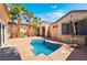 Private pool surrounded by palm trees, offering a serene oasis for relaxation and enjoyment at 3029 Brownbirds Nest Dr, Henderson, NV 89052
