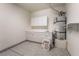 Utility room equipped with ample cabinets, a utility sink, and a water heater at 3029 Brownbirds Nest Dr, Henderson, NV 89052