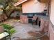 Outdoor area with a built-in grill, sink, and seating area, great for entertaining at 3167 El Cedro Cir, Las Vegas, NV 89121